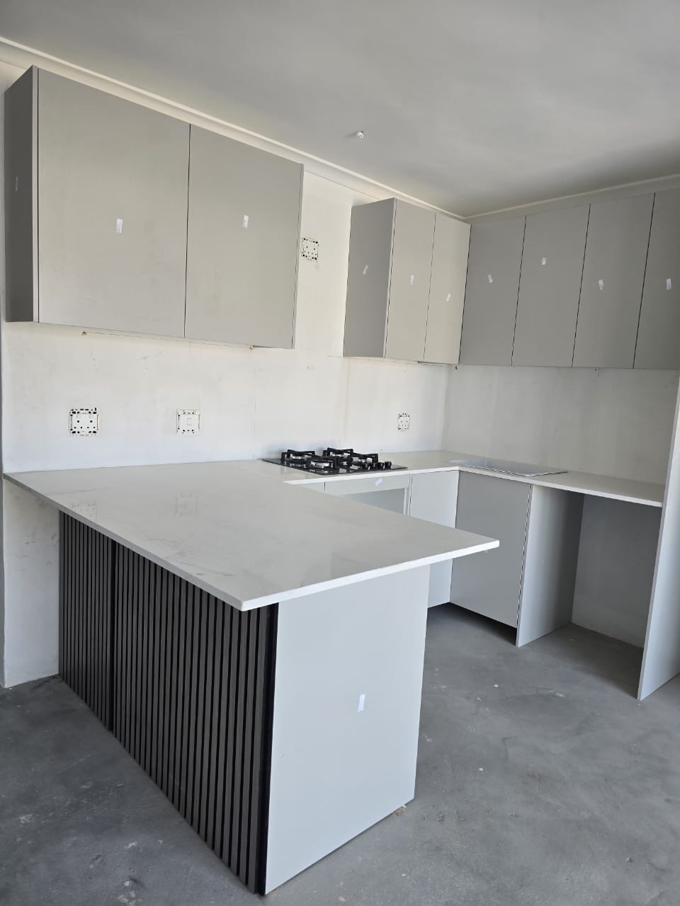 Slatted wood panel kitchen island